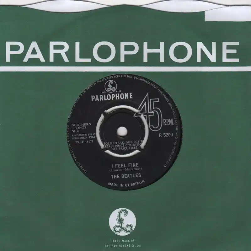 UK Parlophone company sleeve and black Parlophone label for The Beatles single "I Feel Fine" (R 5200, 1964)
