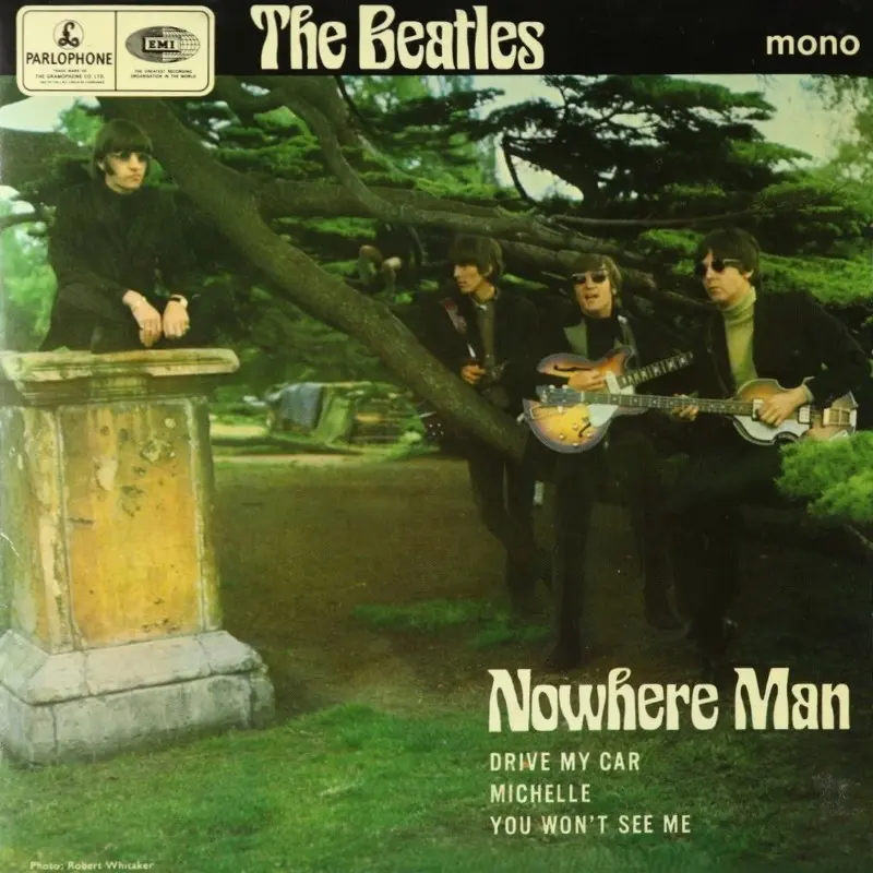 Front cover of The Beatles' Nowhere Man EP showing the band in a garden setting with guitars and a leaning tree
