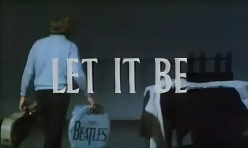 Let It Be Beatles film (1970) behind-the-scenes image showing equipment being carried into the recording studio.